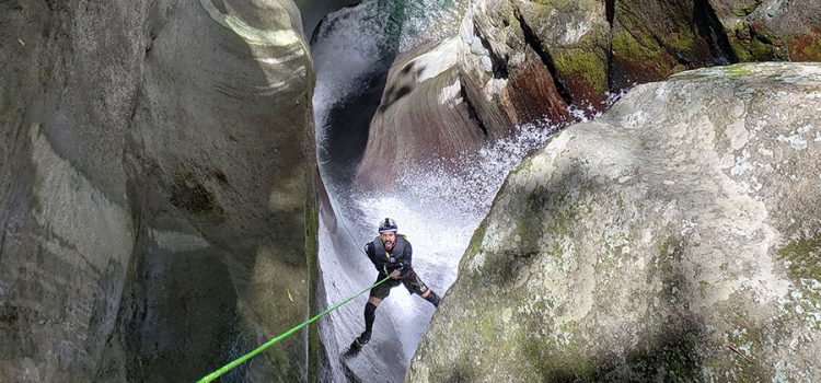Jose Jochi Mendez, founder of Canyoning Puerto Rico, is descending the waterfall of Rio Prieto in Ponce.