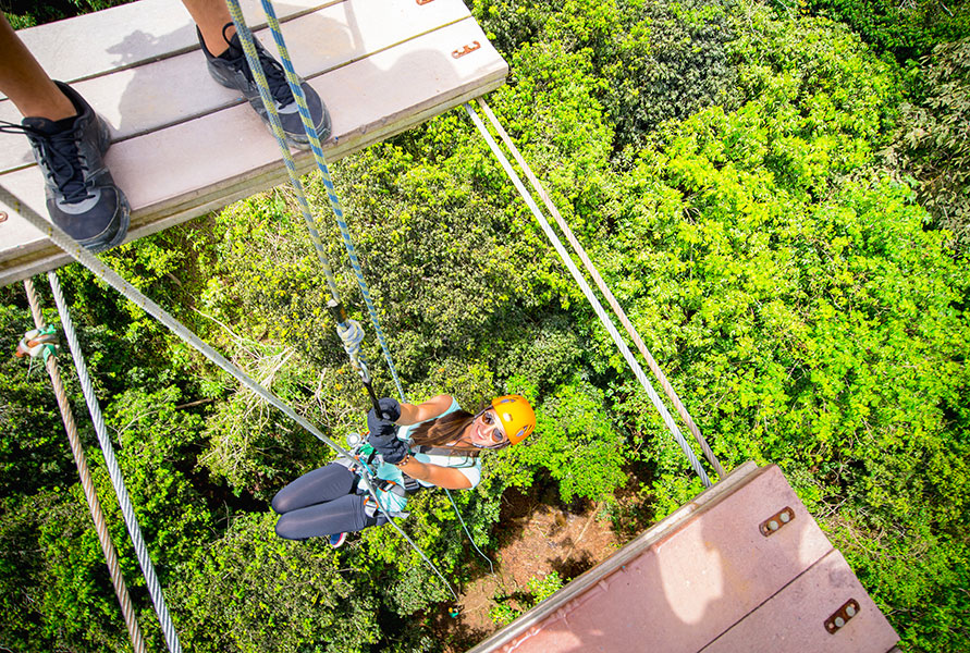 The thrill-seeking group can soar 1,200 feet high through the lush mountains at Toro Verde Adventure Park in Orocovis.