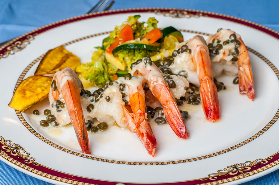 La Ana de Cofresi’s house specialties include Jumbo Shrimps with capers sauce.