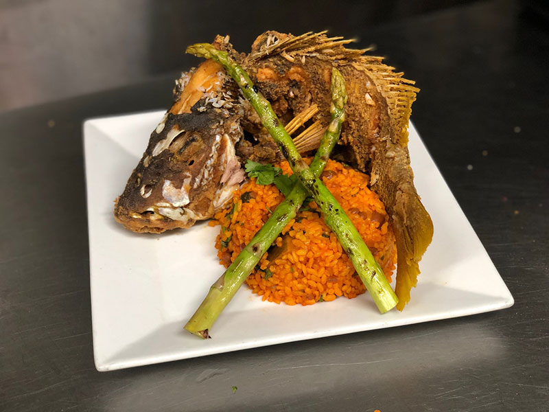 Tamboo Bar & Seaside Grill’s Catch of the Day with Puertorrican “Mamposteao“ Rice and grilled asparagus.